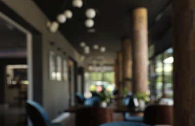 Photo of Blurred view of stylish luxury cafe indoors