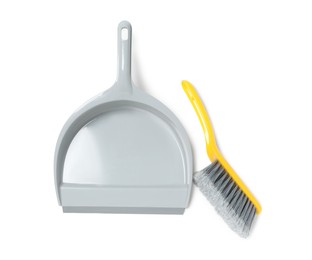 Photo of Plastic hand broom and dustpan on white background, top view