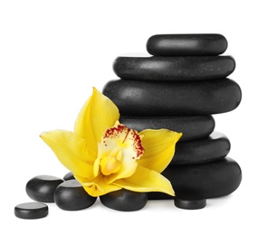 Photo of Spa stones and beautiful orchid on white background