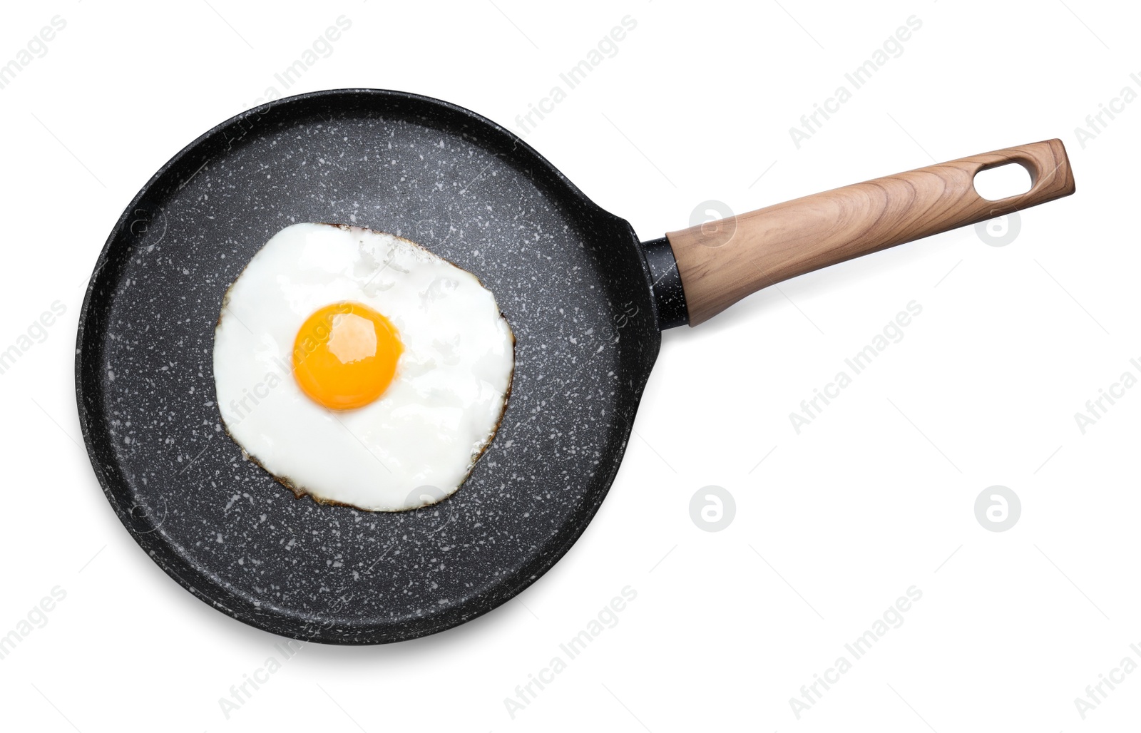 Photo of Frying pan with delicious fried egg isolated on white, top view