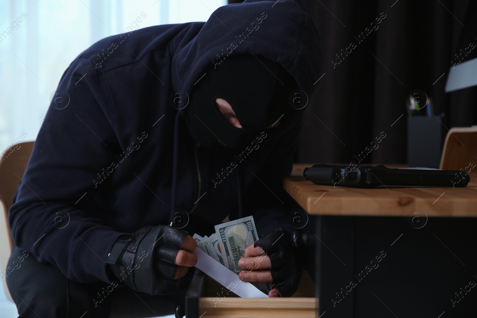 Photo of Dangerous masked criminal stealing money from house