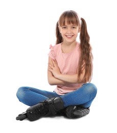 Photo of Girl with inline roller skates sitting on white background
