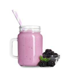 Photo of Freshly made blackberry smoothie in mason jar on white background