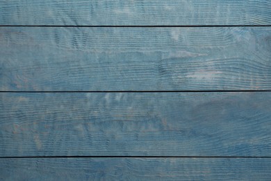 Photo of Texture of light blue wooden surface as background, top view