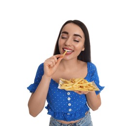 Beautiful young woman eating French fries on white background