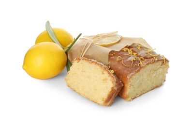 Photo of Wrapped tasty lemon cake with glaze and citrus fruits isolated on white
