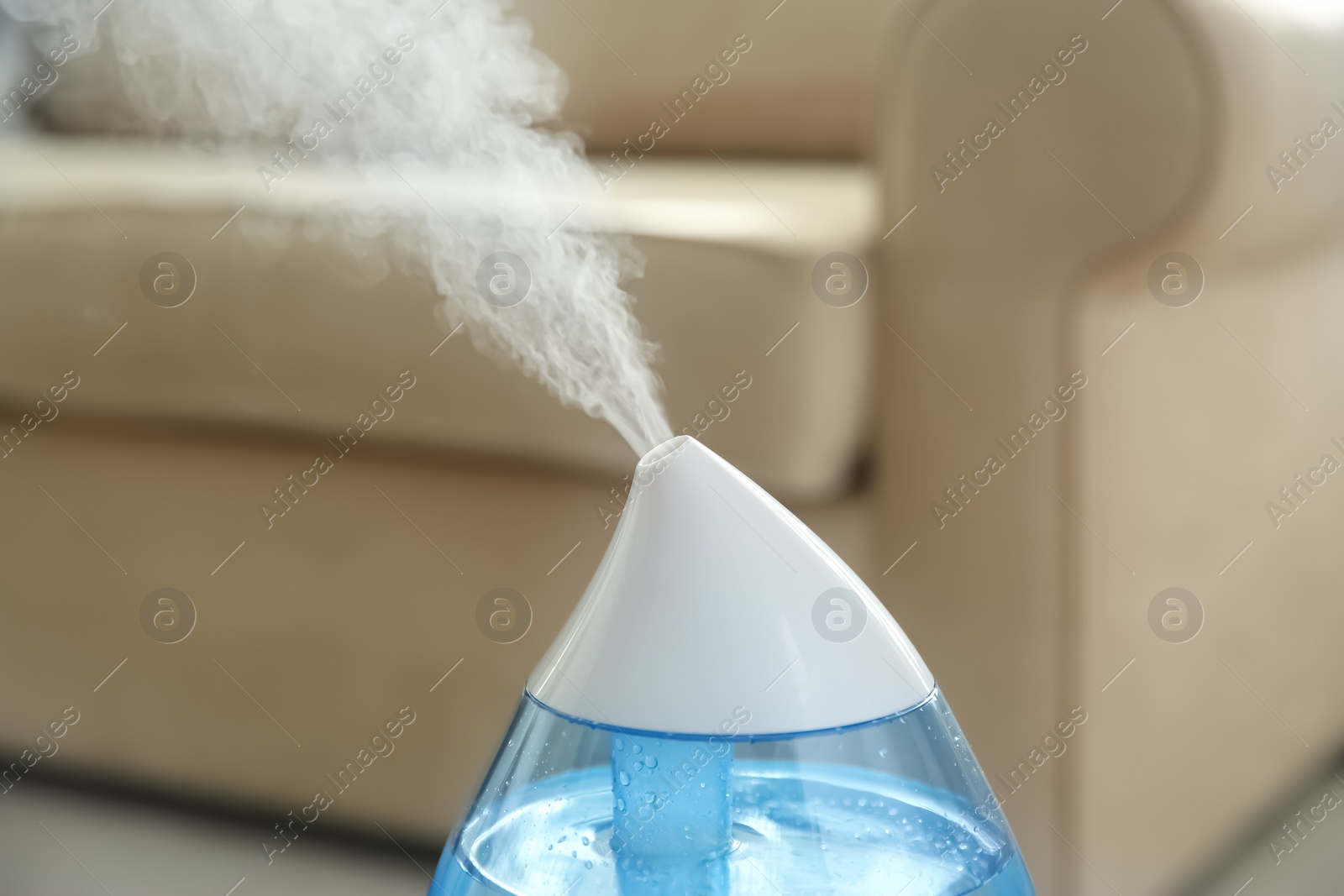 Photo of Modern air humidifier at home, closeup view