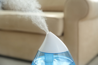 Modern air humidifier at home, closeup view