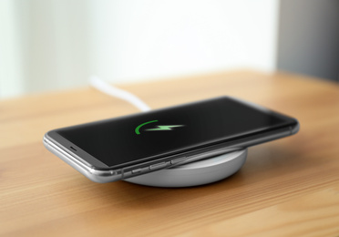 Smartphone charging on wireless pad in room