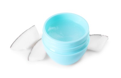 Photo of One lip balm and pieces of coconut isolated on white