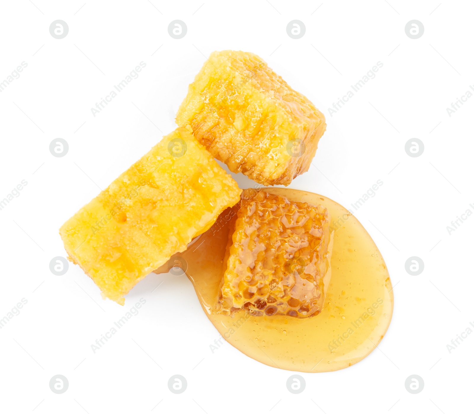 Photo of Pieces of tasty fresh honeycomb isolated on white, top view