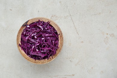 Photo of Tasty red cabbage sauerkraut on table, top view. Space for text