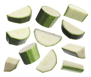 Image of Set with pieces of fresh ripe zucchini on white background