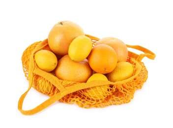 String bag with oranges and lemons isolated on white