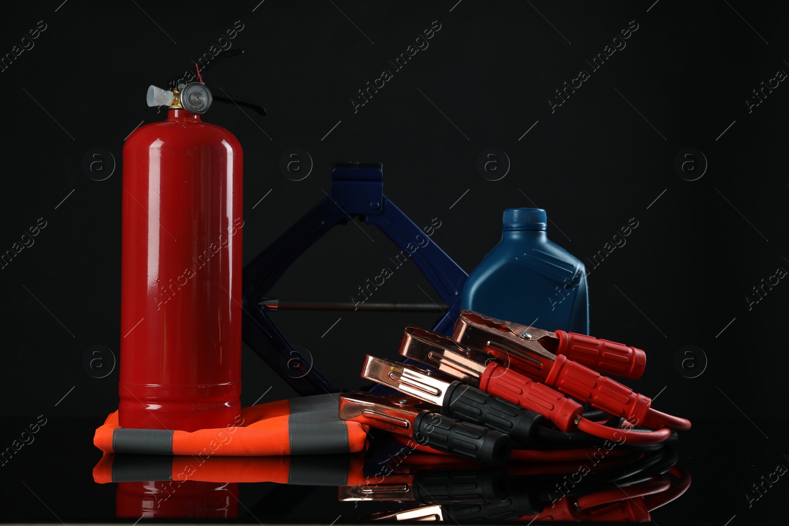 Photo of Set of car safety equipment on black background