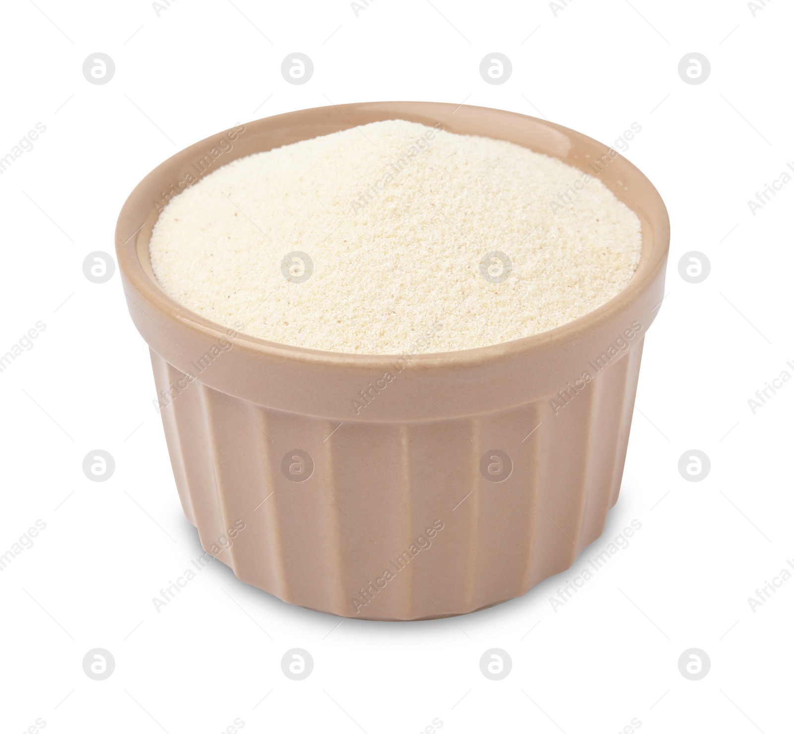 Photo of Bowl of uncooked organic semolina isolated on white