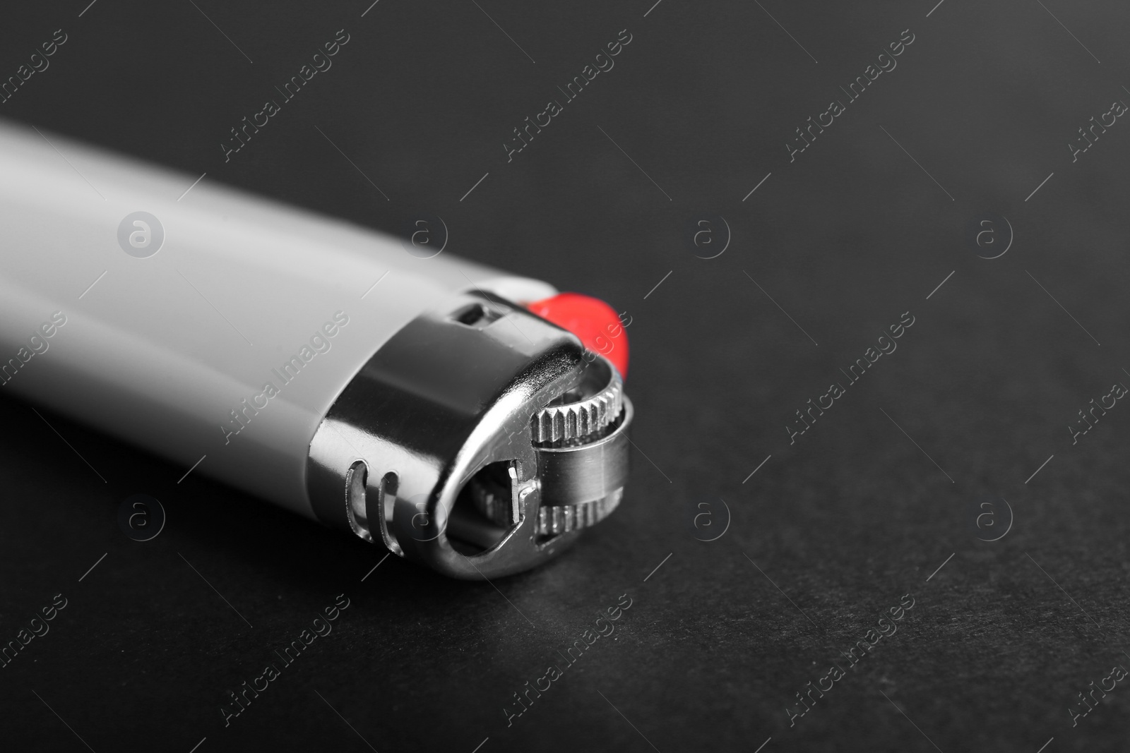 Photo of Stylish small pocket lighter on black background, closeup. Space for text