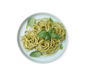 Photo of Plate of delicious pasta with pesto sauce and basil isolated on white, top view