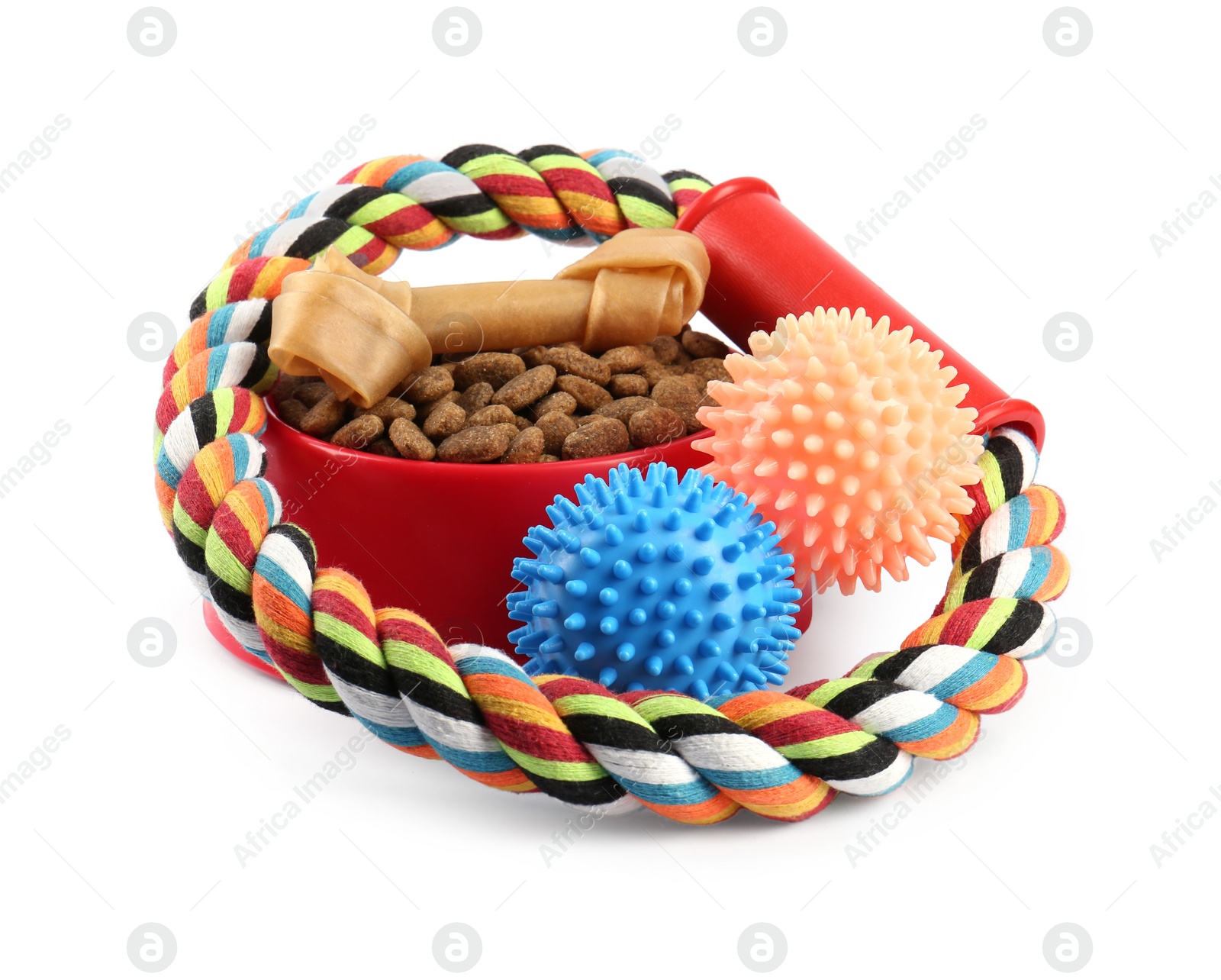 Photo of Pet dry food in bowl, treats and toys on white background. Shop assortment