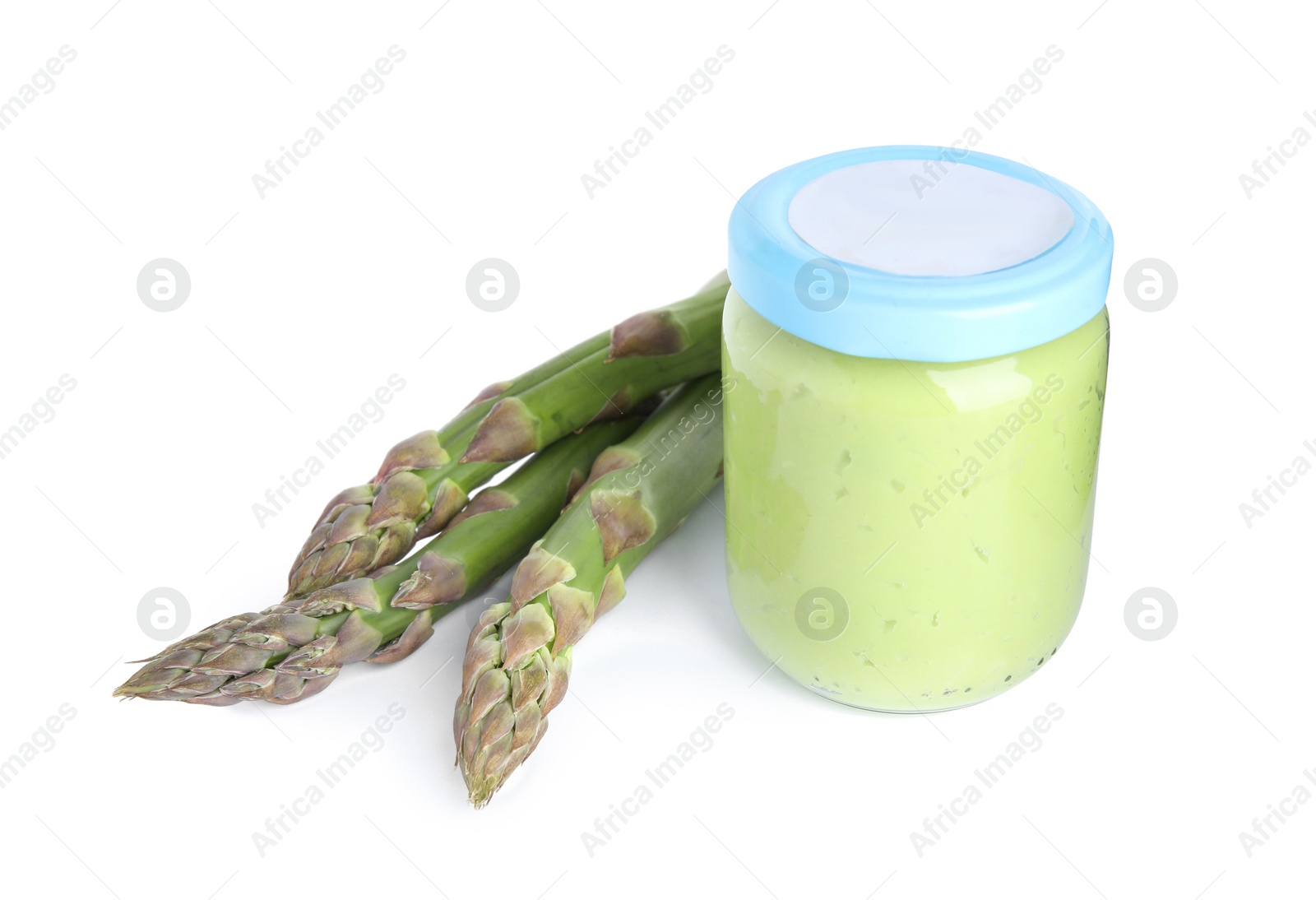 Photo of Jar with healthy baby food and fresh asparagus on white background