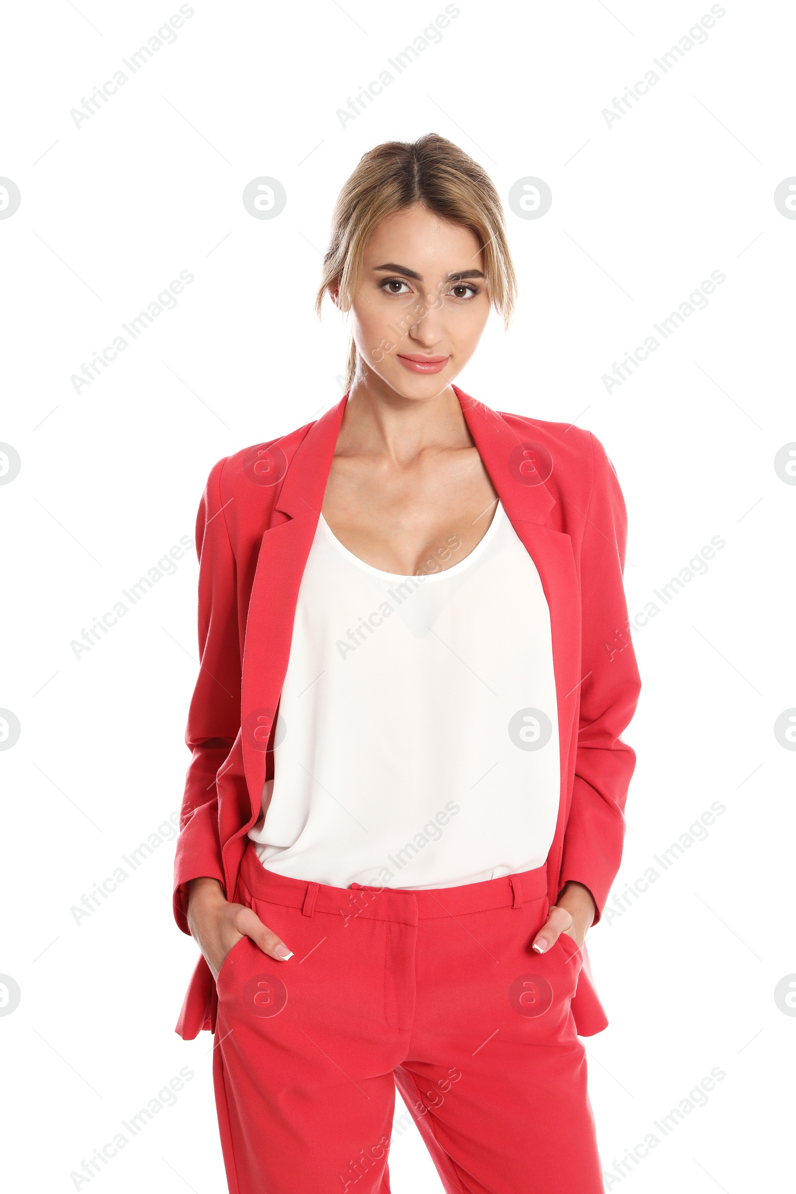 Photo of Beautiful young woman in red suit posing on white background