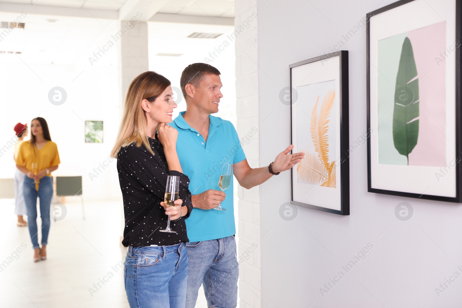 Photo of Couple at exhibition in art gallery