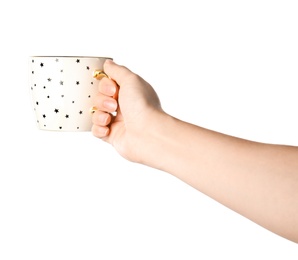 Woman holding cup with small stars on white background, closeup