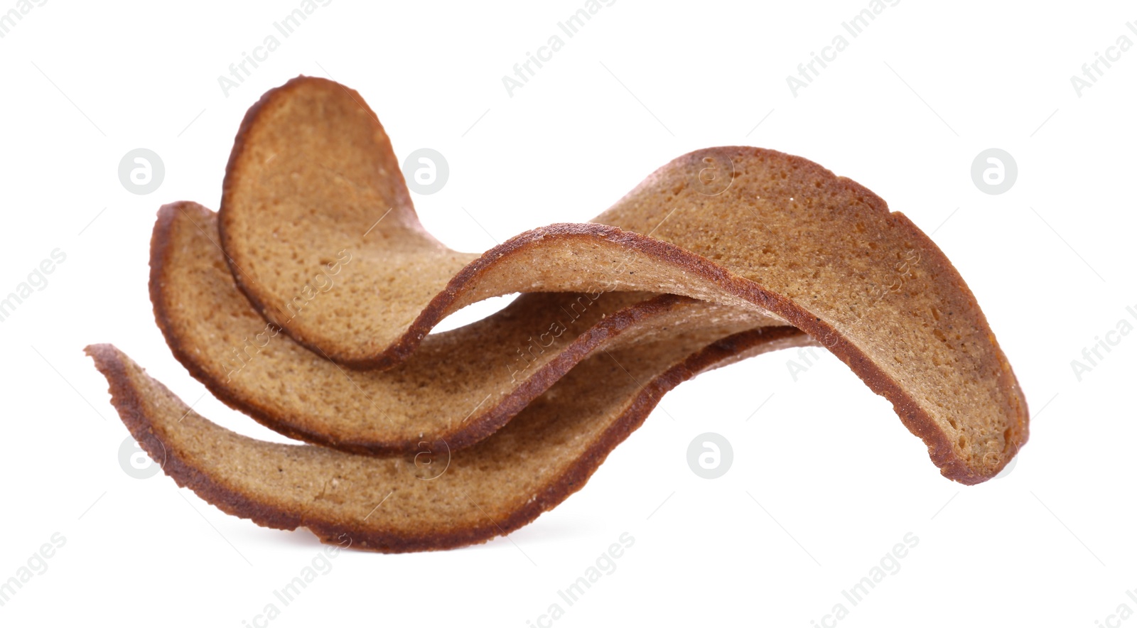 Photo of Delicious wavy crispy rusks on white background