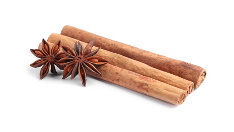 Photo of Aromatic cinnamon sticks and anise stars isolated on white