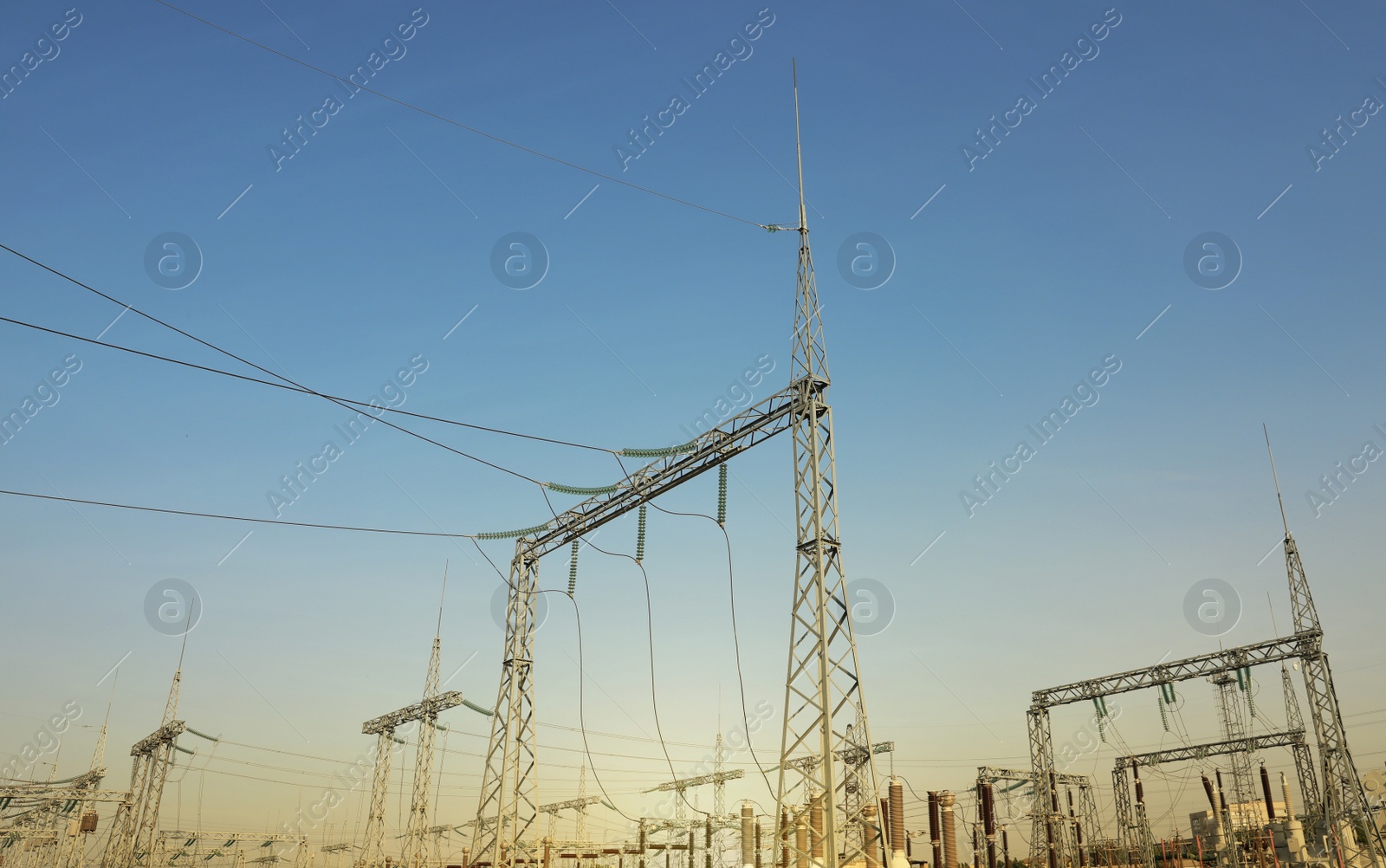 Photo of Modern electrical substation on sunny day, low angle view