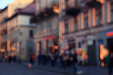 Photo of Blurred view of people walking on city street