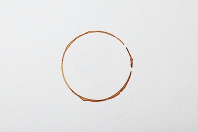 Dried coffee cup stain on white background, top view