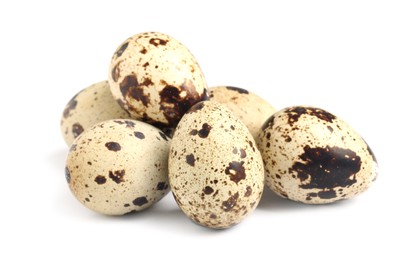 Photo of Many beautiful quail eggs on white background
