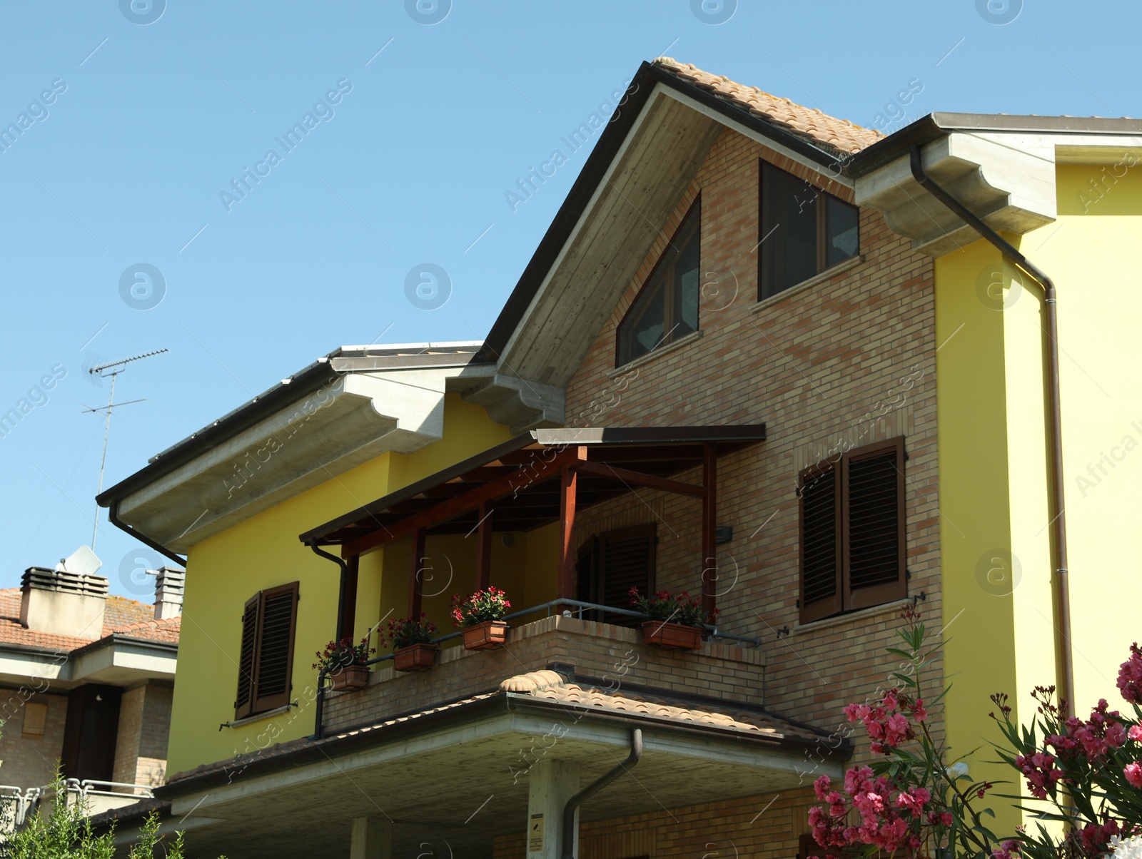 Photo of Exterior of residential building with balcony on sunny day