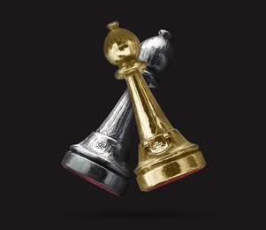 Image of Golden and silver chess bishop in air on black background