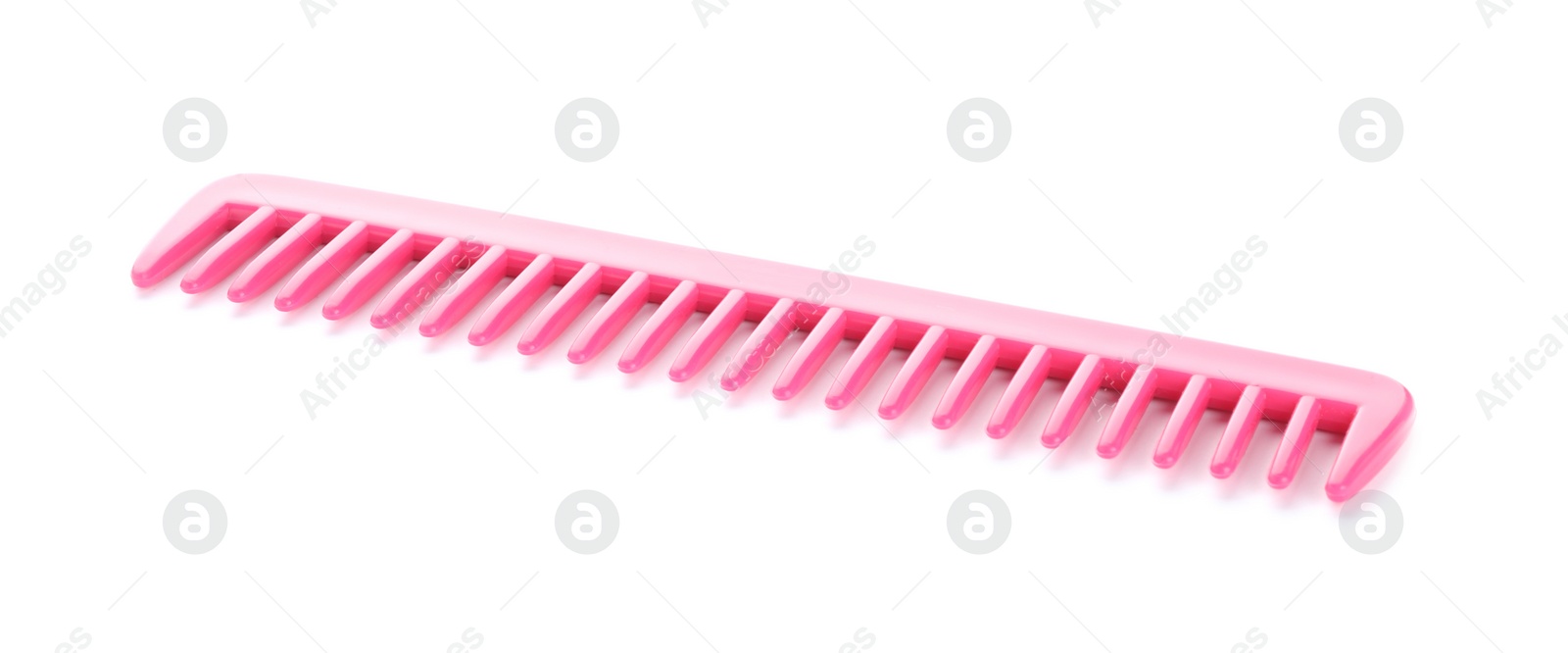 Photo of New pink hair comb isolated on white