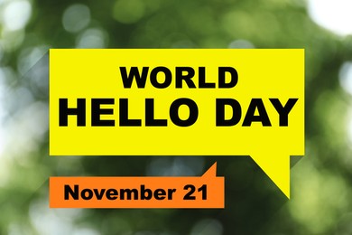 Image of Phrase World Hello Day November 21 on blurred green background. Bokeh effect