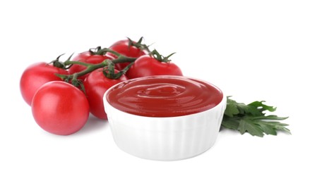 Photo of Bowl with tasty ketchup, parsley and fresh tomatoes isolated on white