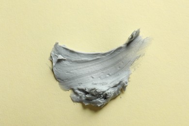 Photo of Sample of face mask on yellow background, top view