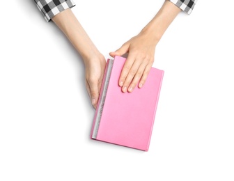 Photo of Woman with notebook on white background, top view. Closeup of hands