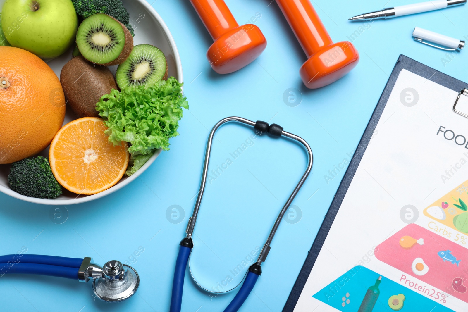 Photo of Fruits, vegetables, dumbbells, stethoscope and list of products on light blue background, flat lay. Visiting nutritionist