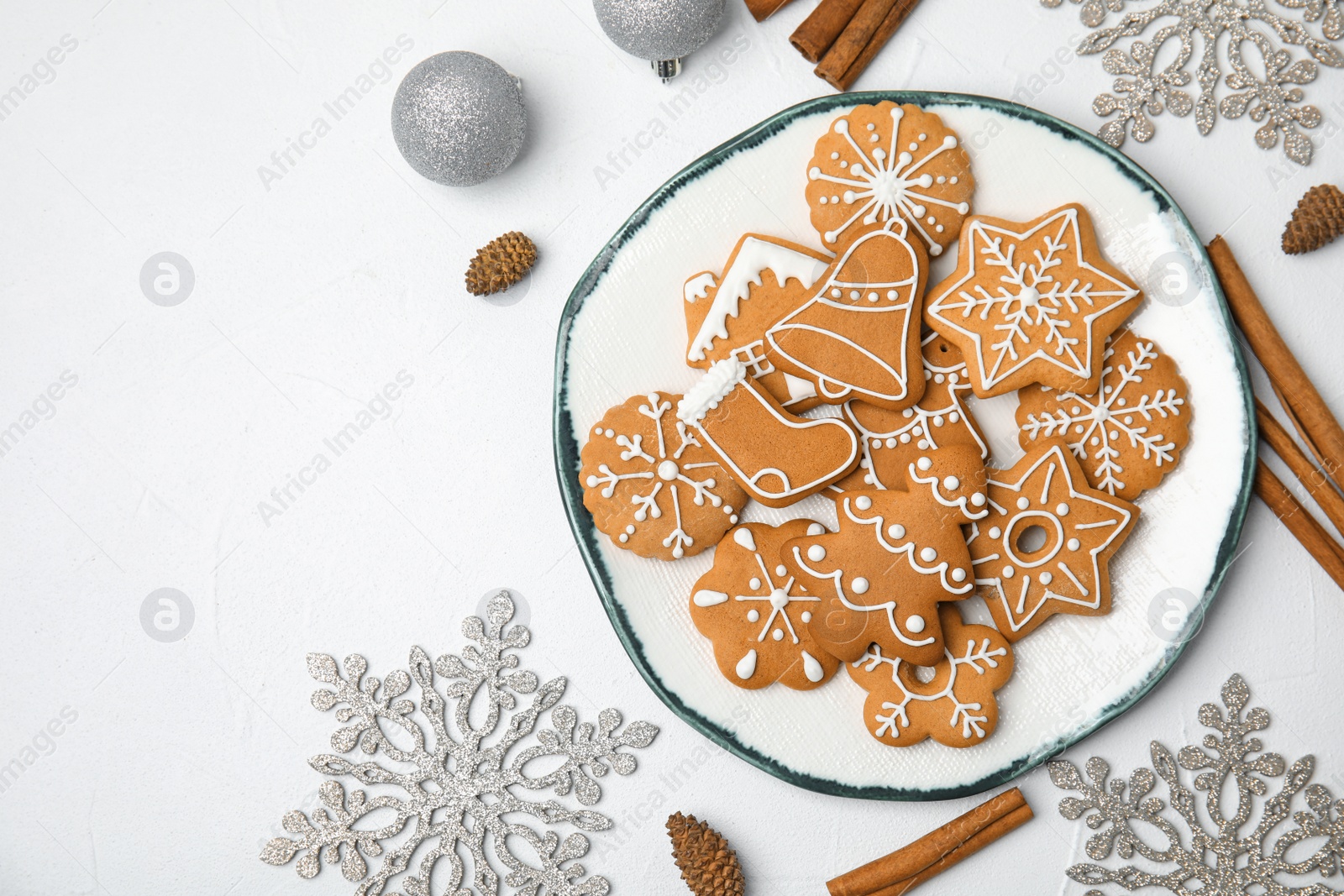 Photo of Plate with tasty homemade Christmas cookies on table, top view