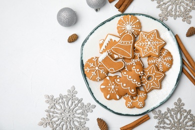 Plate with tasty homemade Christmas cookies on table, top view