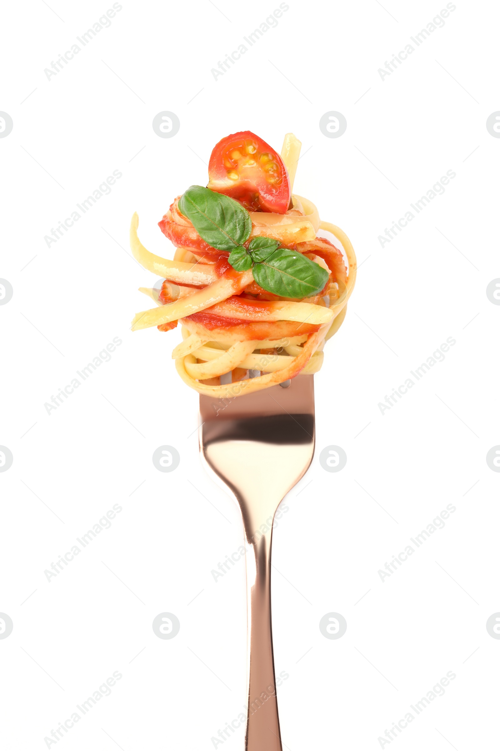 Photo of Fork with tasty pasta, tomato sauce and basil isolated on white, top view