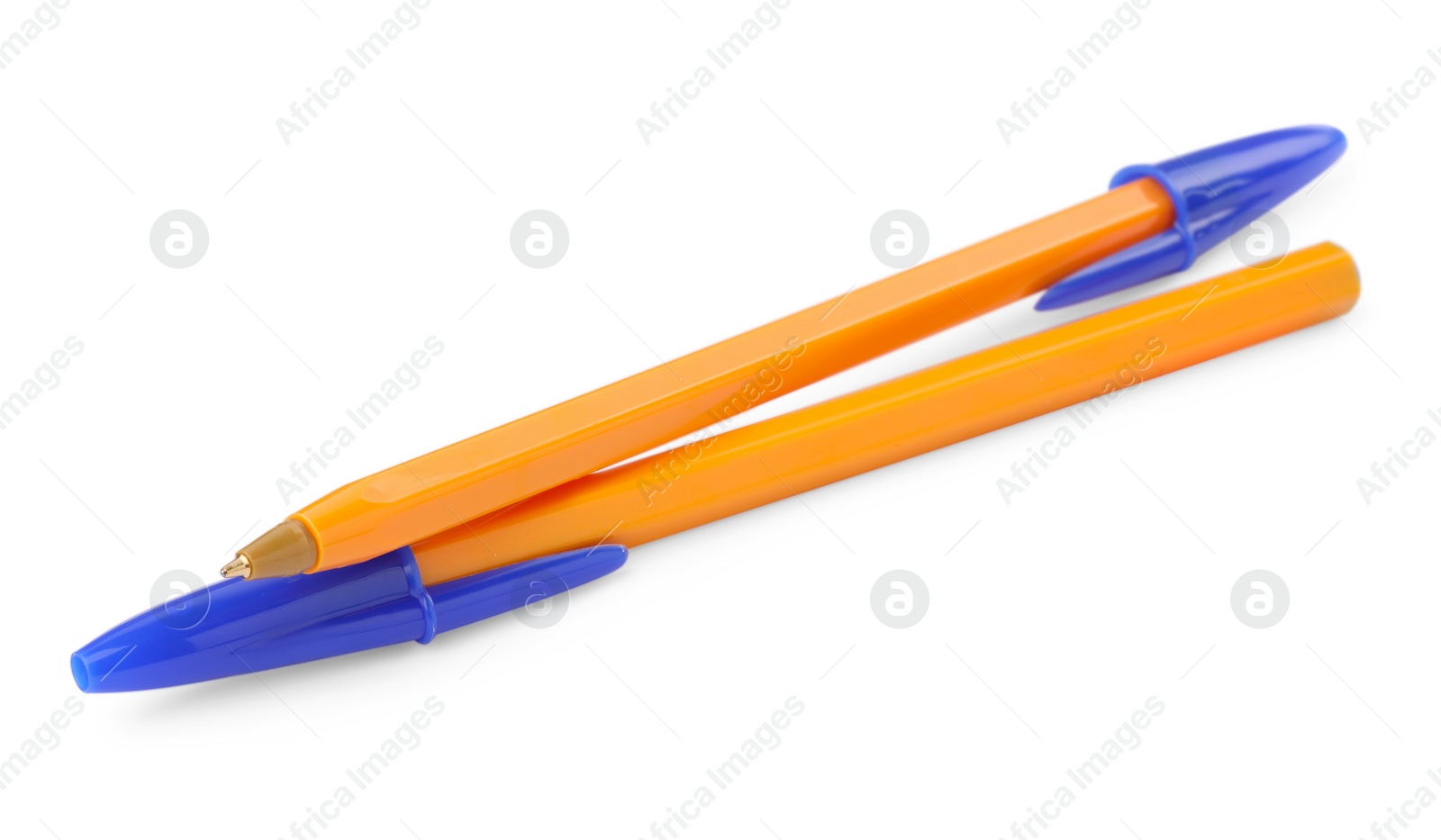 Photo of New orange plastic pens isolated on white