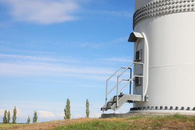 Photo of Entrance to wind turbine power generator outdoors. Alternative energy source