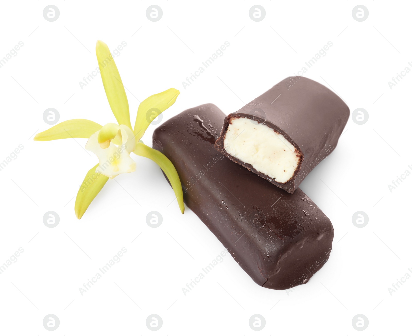 Photo of Glazed curd cheese bars and vanilla flower isolated on white