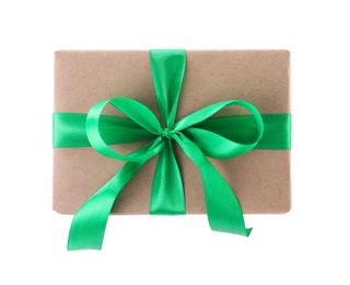 Photo of Christmas gift box decorated with ribbon bow on white background, top view