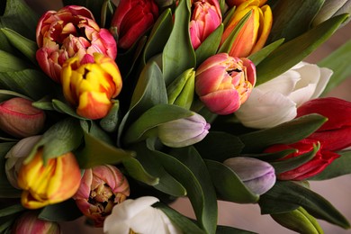 Photo of Beautiful bouquet of colorful tulip flowers, closeup