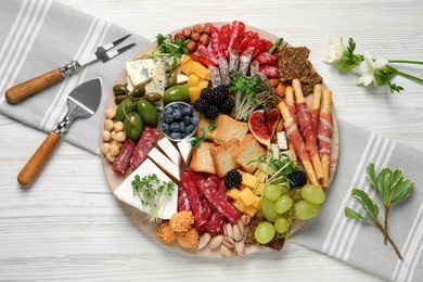 Photo of Different tasty appetizers on white wooden table, flat lay